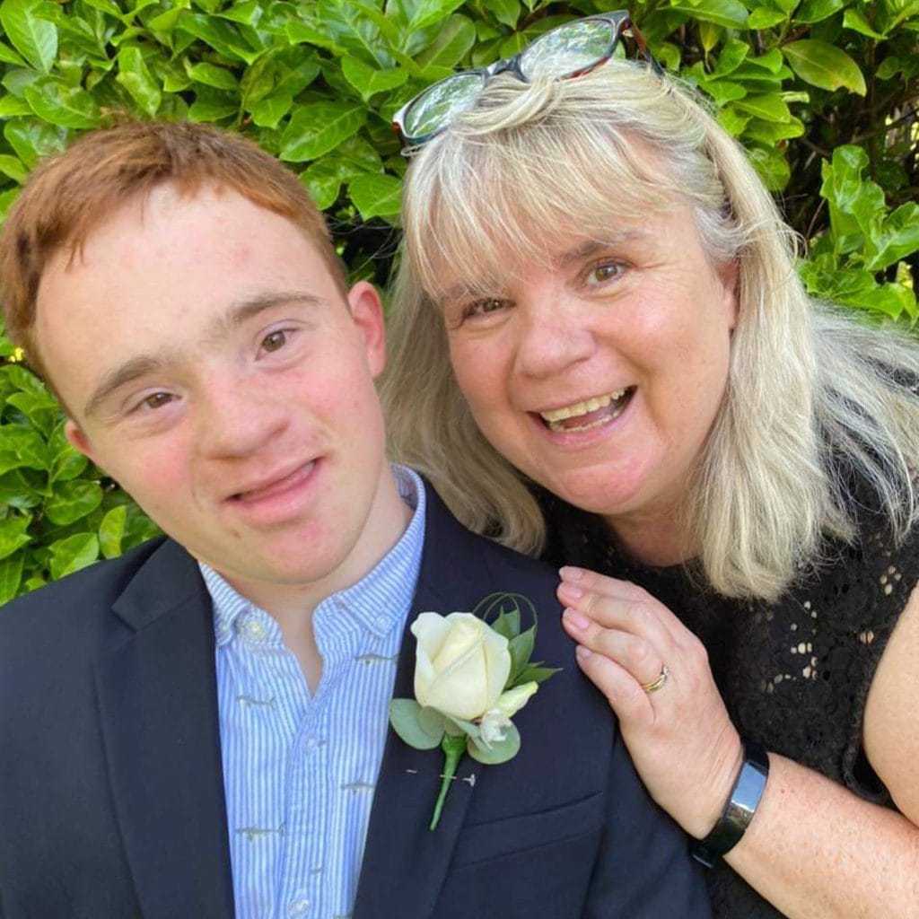 Nicola Enoch with son Tom, they look like they're dressed for a special occasion like a wedding
