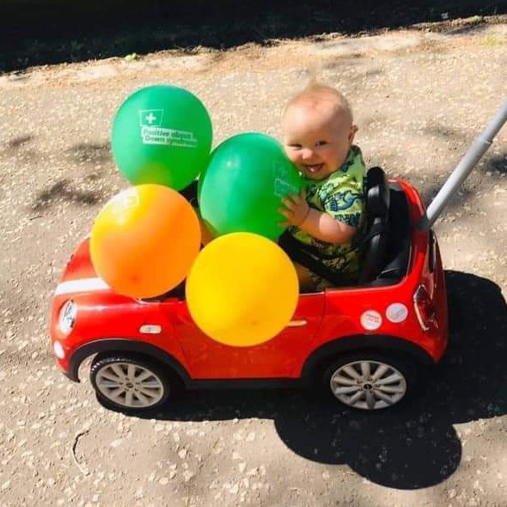 baby in push along car during the Big PADS push