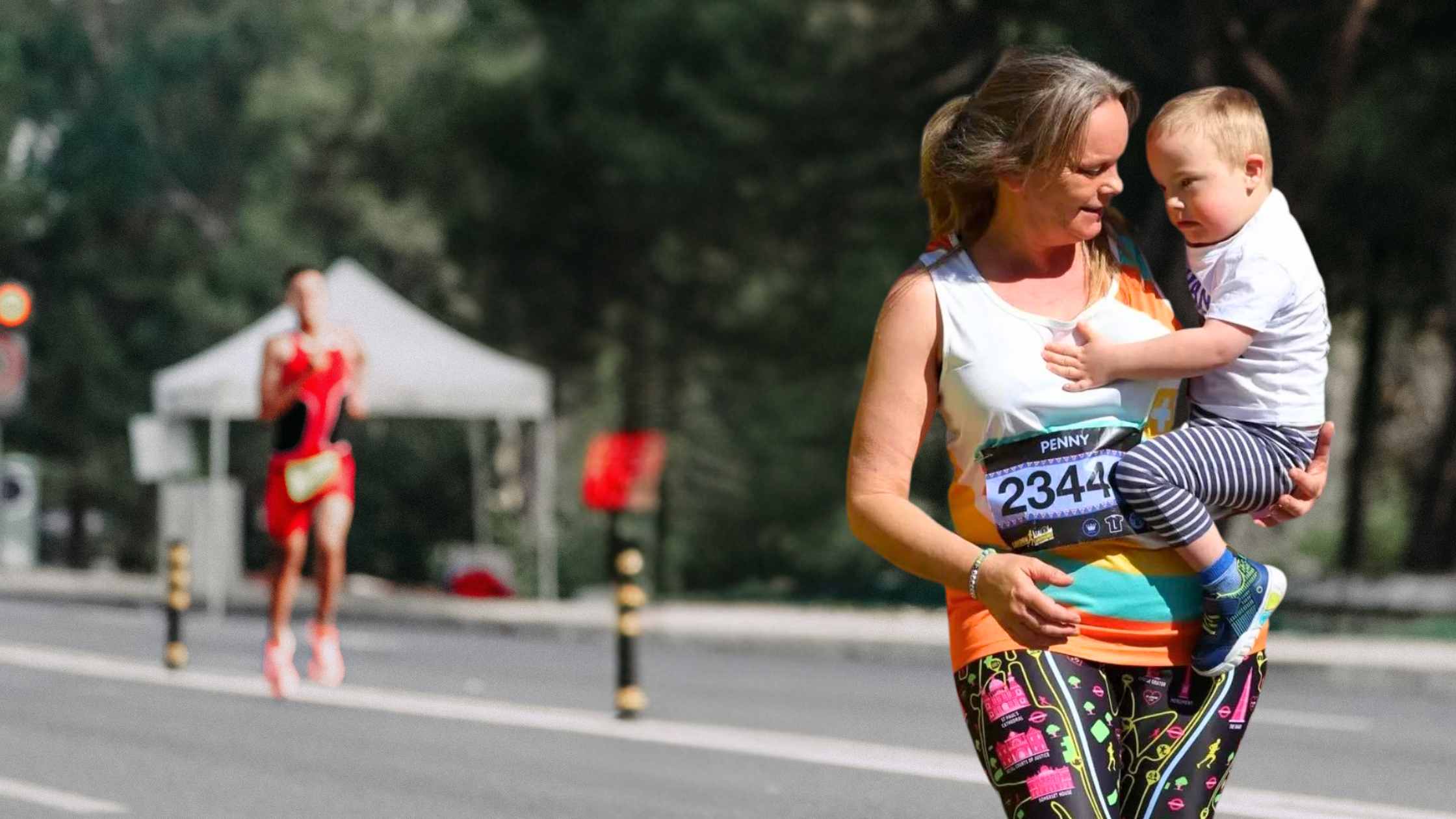 Woman completes London Landmarks holding child